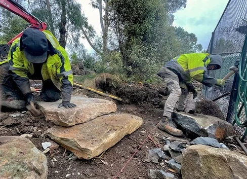 Working on Dry Stone Walling, Victoria, Australia