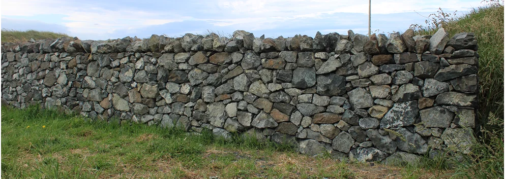 Restored Oki Street stone wall